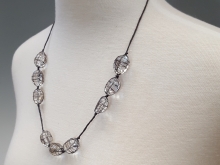 Cord with quartz crystal beads